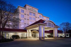 a hotel building with a sign on top of it at Delta Hotels by Marriott Norfolk Airport in Norfolk