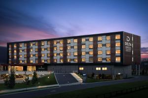 a large building with a sign on the front of it at Delta Hotels by Marriott Vancouver Delta in Delta