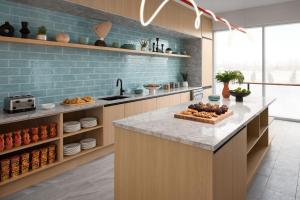 a kitchen with a counter with a tray of food at Delta Hotels by Marriott Vancouver Delta in Delta