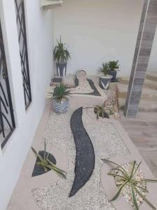 a hallway with plants on the floor of a building at Paradis in Ngaparou