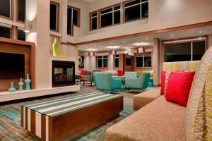a lobby with a couch and a fireplace at Residence Inn by Marriott Kingston in Kingston