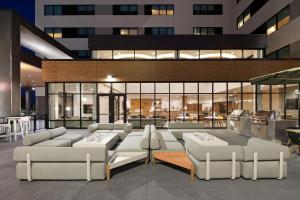 a lobby of a building with couches and tables at Element Bloomington Mall of America in Bloomington