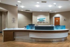 a waiting room at a hospital with blue at SpringHill Suites by Marriott Orlando North-Sanford in Sanford