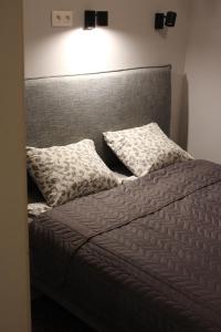 Posteľ alebo postele v izbe v ubytovaní GreyBlack Styles Apartment