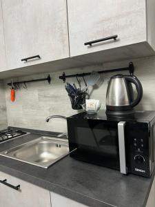 Una cocina o cocineta en Napoli Centro-La casa di Lucio