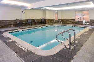 a large swimming pool in a hotel room at Fairfield Inn & Suites by Marriott Pittsburgh New Stanton in New Stanton