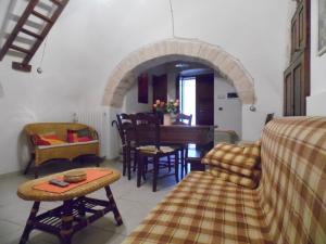 a living room with a couch and a table at Trulli migrado in Alberobello