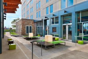 a group of benches outside of a building at Aloft Vaughan Mills in Vaughan