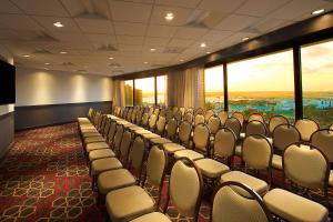 a conference room with chairs and a large window at Four Points by Sheraton San Diego Downtown Little Italy in San Diego