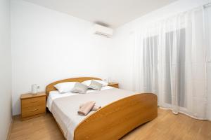 Postel nebo postele na pokoji v ubytování Apartments with parking spaces Kraj, Pasman - 819