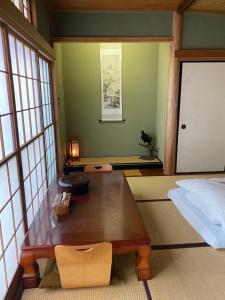 Postel nebo postele na pokoji v ubytování 宮城野ハウス＆離れ