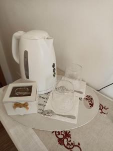a counter with a coffee maker and other items on it at La Casina b&b in Ancona