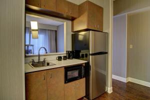 a kitchen with a sink and a refrigerator at Courtyard by Marriott Tysons McLean in Tysons Corner