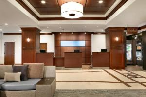 a lobby with a couch and a waiting room at Courtyard by Marriott Tysons McLean in Tysons Corner