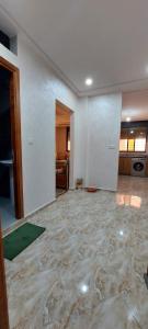 an empty living room with a large marble floor at Tamraght agadir in Tamraght Ouzdar
