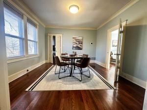 an empty living room with a table and chairs at Luxury Lenox Townhouse in Memphis