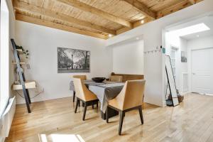 a dining room with a table and chairs at STUNNING condos on ST Denis in Montréal