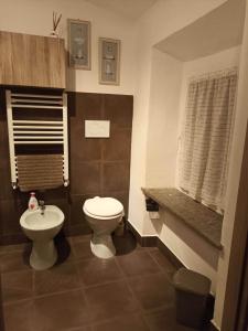 a bathroom with a toilet and a sink at La Casina b&b in Ancona