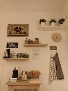 a wall with shelves and a clock and a table at La Casina b&b in Ancona +27 photos