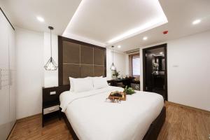 Voodi või voodid majutusasutuse Keypad Hotel - 24 Hang Ga toas