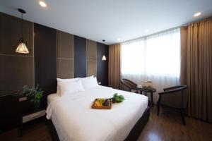Postel nebo postele na pokoji v ubytování Keypad Hotel - 24 Hang Ga + 36 fotografií