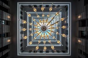 a gold snowflake on a window in a building at Prestige Hotel Budapest in Budapest