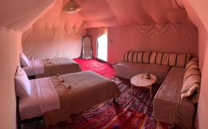 Posteľ alebo postele v izbe v ubytovaní Sahara wellness camp