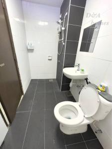 a bathroom with a toilet and a sink at Ipoh Majestic Condo by D&A homes in Ipoh
