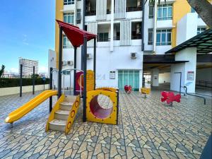 a playground with a slide and a slideintend at Ipoh Majestic Condo by D&A homes in Ipoh