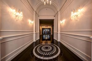 a hallway with a spiral staircase in a building at Prestige Hotel Budapest in Budapest