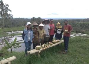 a group of people standing in front of a river at NUHA HOMESTAY in Licin