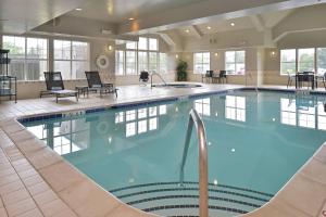 a large swimming pool in a hotel lobby at Residence Inn by Marriott Loveland Fort Collins in Loveland