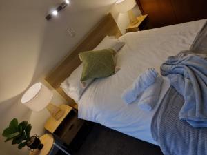 a bedroom with a bed with towels on it at Warm Cosy Paynesville Get-Away in Paynesville