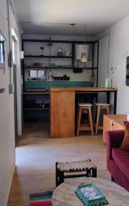 a living room with a couch and a table at El Trotamundos in Puerto Pirámides