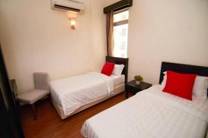 מיטה או מיטות בחדר ב-Fun Splash Water Park Resort Melaka - Free ticket UNLIMITED ENTRY