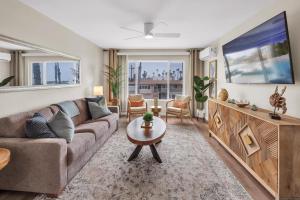 a living room with a couch and a tv at Tower 9 #5 in Oceanside