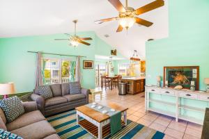 a living room with a couch and a table at Key Lime Time in Cudjoe Key