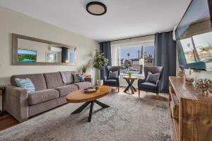 a living room with a couch and a table at Tower 9 #4 in Oceanside