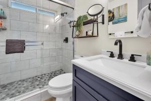 a bathroom with a sink and a toilet at Tower 9 #4 in Oceanside