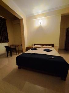Cama o camas de una habitación en D'souza's Guest House