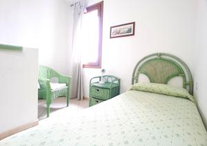A bed or beds in a room at Santa Teresa Sea View apartment - Private Parking & WiFi