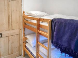 a couple of bunk beds in a room at New Cottage in Penmaenpool