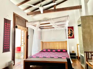 Postel nebo postele na pokoji v ubytování Isana Beach House
