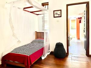 Postel nebo postele na pokoji v ubytování Isana Beach House