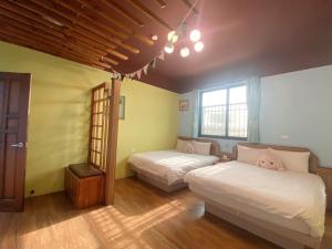 Letto o letti in una camera di Big Fish Homestay