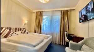 Postel nebo postele na pokoji v ubytování Hotel Austria