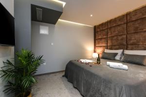 a bedroom with a large bed in a room at Luxury Rooms LaVie - Superior Rooms in Zadar +31 photos