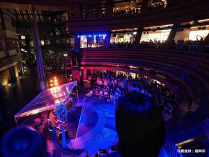a crowd of people watching a concert in a building at Sky Heart Hotel Hakata in Fukuoka