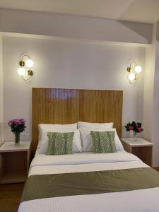 Postel nebo postele na pokoji v ubytování Hotel Pegasus Crown