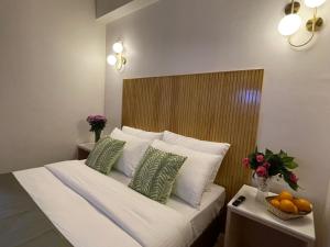 Postel nebo postele na pokoji v ubytování Hotel Pegasus Crown